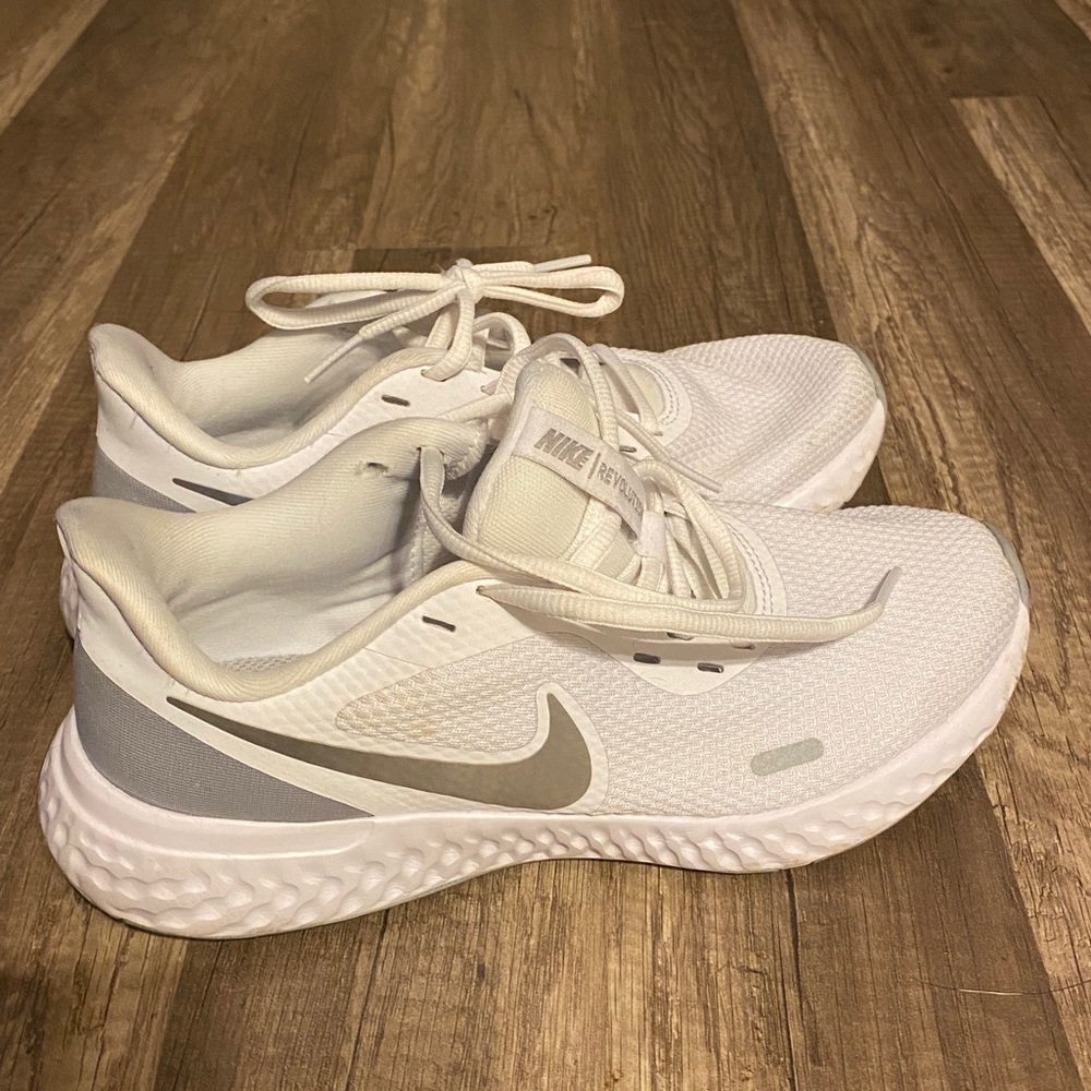 white nike athletic shoes
